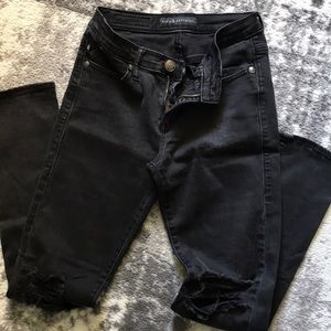 Rock & Republic Black Destructed Skinny Jeans.